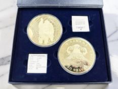 A 2014 United States of America two-coin presentation set : Two Twenty Dollar Gold-Plated Oversized