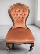 A Victorian carved walnut lady's salon chair.