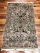 A fine Chinese silk rug, 160 cm x 92 cm.