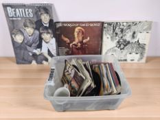 A group of mainly 45 RPM vinyl records and LPs including The Beatles, David Bowie,