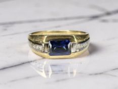 A 9ct gold synthetic sapphire and diamond ring, size V CONDITION REPORT: 4.