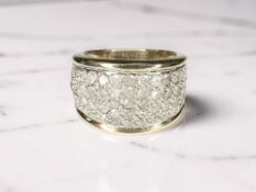 A 9ct gold ring pavé-set with diamonds, the stated total diamond weight 1.
