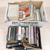 A collection of vintage sheet music and music books.
