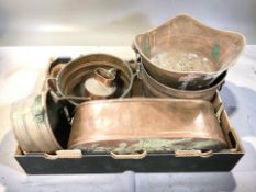 A group of copper planters, watering can, etc.