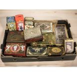 A group of vintage tins and money boxes.