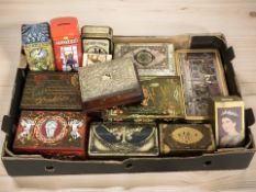 A group of vintage tins and money boxes.