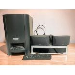 A Bose Model AV3-2-1 media centre, a pair of speakers and a further Bose Acoustimass module,