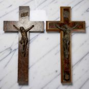 Two walnut and patinated metal crucifixes, one dated 1931, length 25cm.