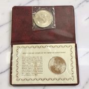 A 1948 Mexican 5 Pesos Silver Crown, with paperwork, in red vinyl walet, weight 30 g.