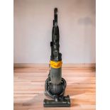 A Dyson DC25 upright vacuum cleaner.