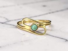 A turquoise ring, stamped 750, size J½ CONDITION REPORT: 1.