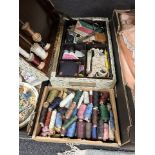 A sewing box and contents, various spools of thread, etc.