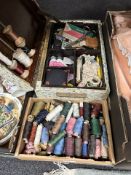A sewing box and contents, various spools of thread, etc.