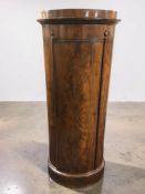 A 19th century mahogany oval pedestal cabinet, width 60 cm.