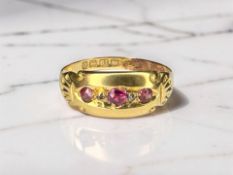 An 18ct gold ruby and diamond ring, size O CONDITION REPORT: 1.