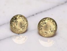 A pair of 9ct gold disc ear studs with butterfly fittings,