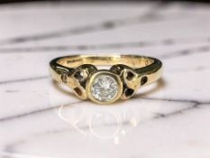 A 9ct gold diamond solitaire ring, the stated diamond weight 0.