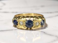 An 18ct gold sapphire and diamond five stone ring, size Q CONDITION REPORT: 3.