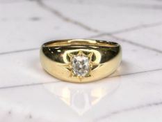 An 18ct gold gypsy-set diamond ring, the oval old-cut stone weighing approximately 0.
