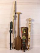 A Scandinavian carved and painted wooden mangleboard, length 70 cm, together with an African staff,