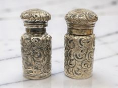 A matched pair of silver perfume bottles, Birmingham 1900 and 1903, height 7.