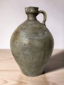 A large earthenware jug, height 45 cm.
