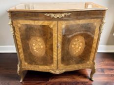 A bow front ormolu mounted inlaid continental double door cabinet, width 101 cm.