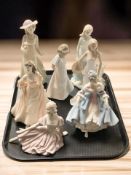 A group of seven china figures including Royal Doulton Southern Belle,