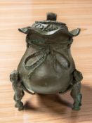 A reproduction oriental bronze jar and cover, height 32 cm.