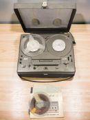 A Tandberg two track Series 15 reel-to-reel player, together with a quantity of reels.