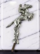 A Desmo horse and jockey chrome-plated car mascot, height 15.5cm excluding screw thread.