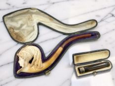 A Meerschaum pipe modelled as a lady in classical headdress (stem cracked),