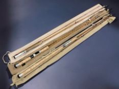 Three vintage two piece split cane fishing rods including a Scottie The Scotia rod,