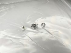 Three loose brilliant-cut diamonds, the larger weighing 0.28 carat, the smaller two 0.08 carat each.