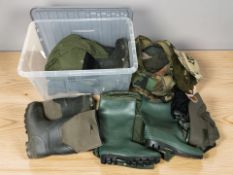 A group of wellington boots, fishing waders, gloves, headwear, etc.