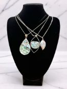 An abalone and silver pendant on chain, a larimar pendant,