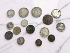 A small group of world coins including silver examples