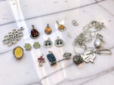 A group of decorative pendants, earrings, necklaces, including a pair of peridot cluster earrings,