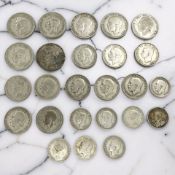 A group of British pre-1947 silver coins including half crowns, florins, shillings, mixed grades,