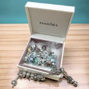 A Pandora bracelet with fifteen charms, length 17.
