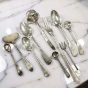 A group of mixed silver cutlery, teaspoons, pusher, small ladle,