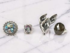 Three large gem-set statement rings, plus another modelled as daffodils, all stamped 925.