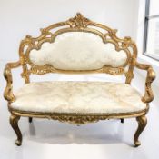 A reproduction French style gilded salon settee, width 112 cm.