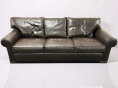 A contemporary brown stitched leather three seater settee, width 235 cm.