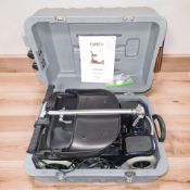 A Care Co 'Scootcase' folding mobility scooter, with operating instructions,