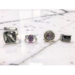 Four silver gem-set dress rings CONDITION REPORT: 56.
