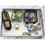 A 9ct gold and silver dress ring, two enameled star fobs, one silver,