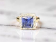 A 9ct yellow gold synthetic sapphire dress ring, size N 1/2 CONDITION REPORT: 3.