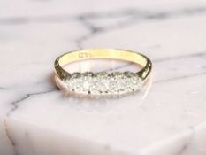 An 18ct yellow gold diamond set dress ring, size M CONDITION REPORT: 2.