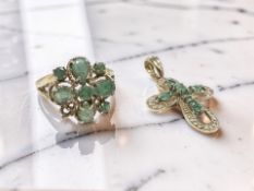 A 9ct yellow gold crucifix pendant set with emeralds,